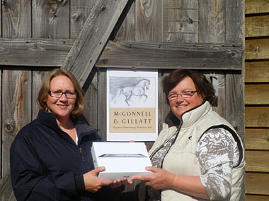 Practice Manager Fiona Boyne receives the prize on behalf of winner Claire O'Meara